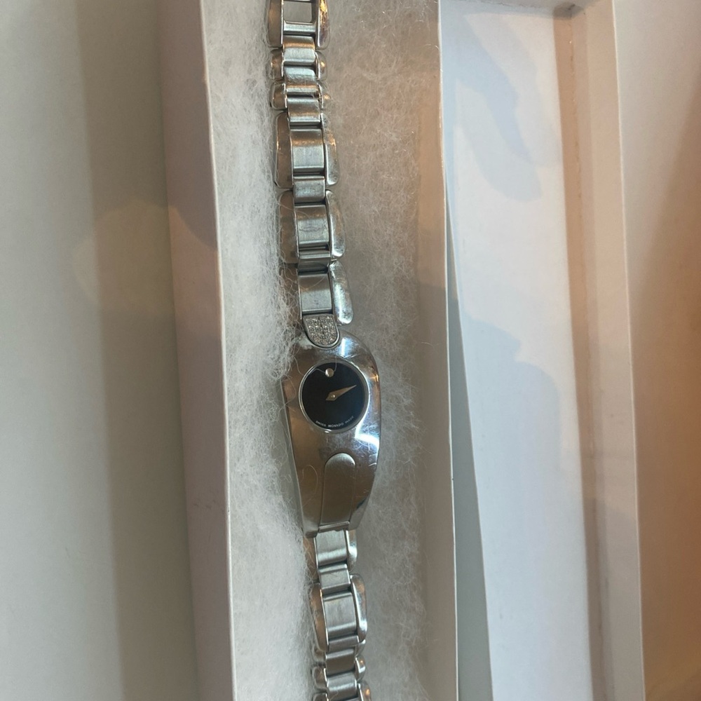 Movado Silver Watch with Metal Band and Circular Face